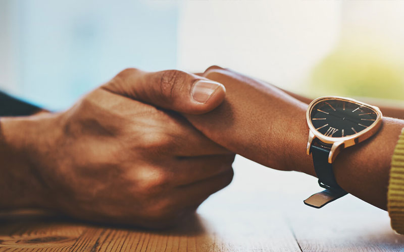 Holding Hands Supportively