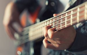 Close up of someone playing a guitar